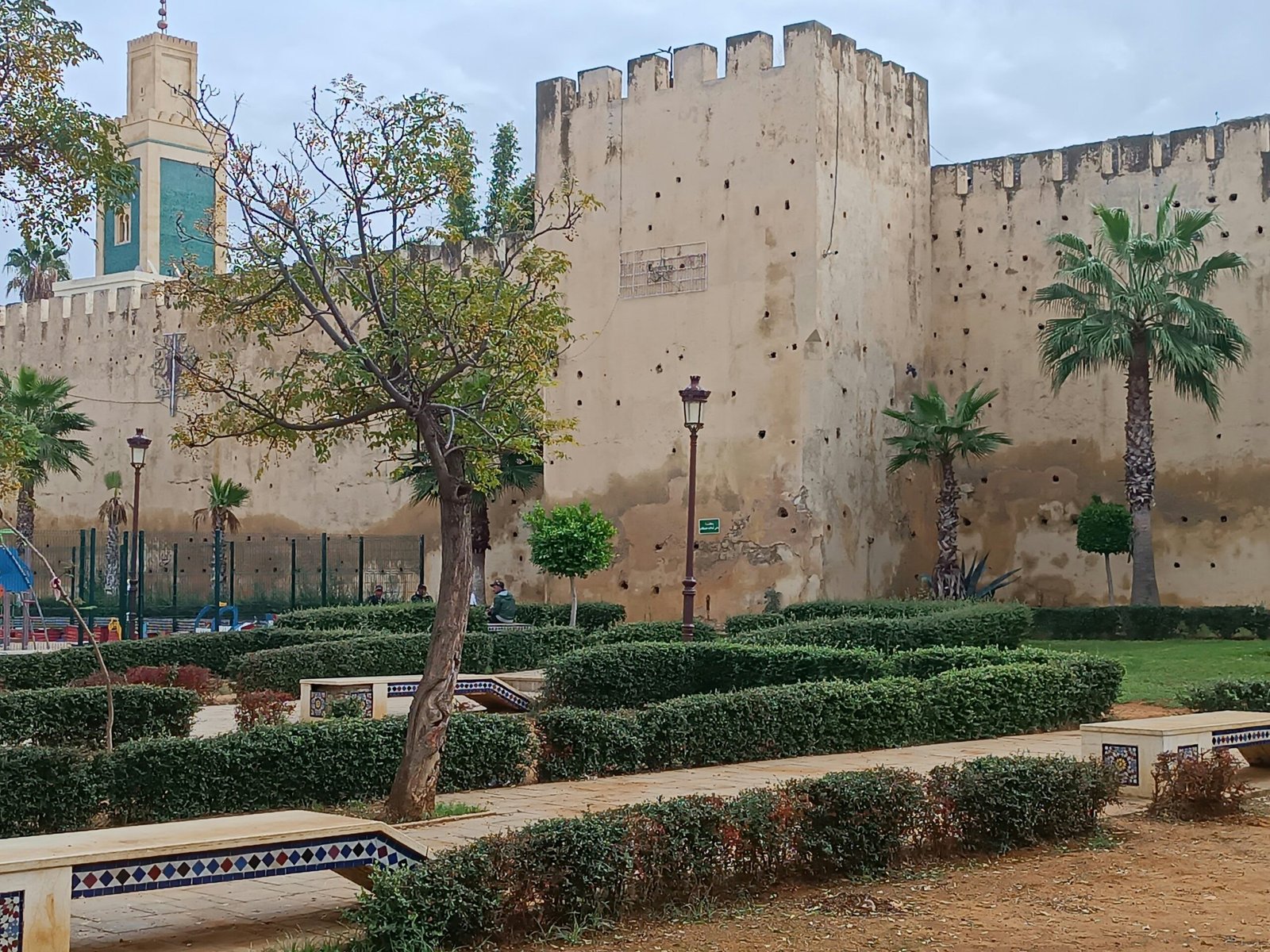 Historic castle-like building with garden in Meknes, Morocco