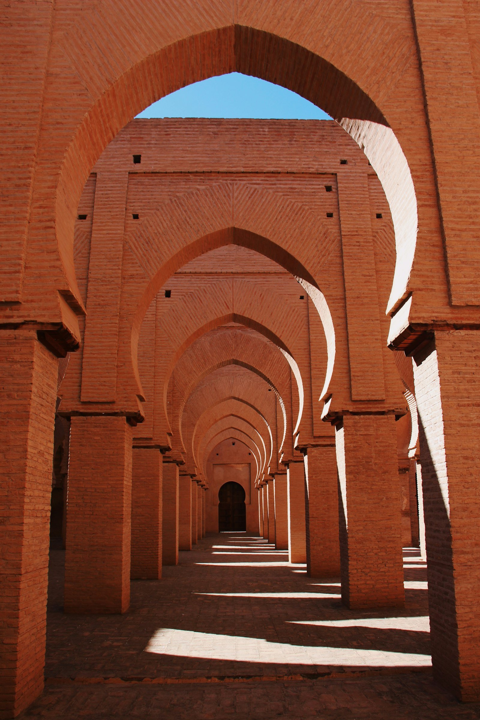 Hypnotic red-brick Almohad arches of the Tinmel Mosque