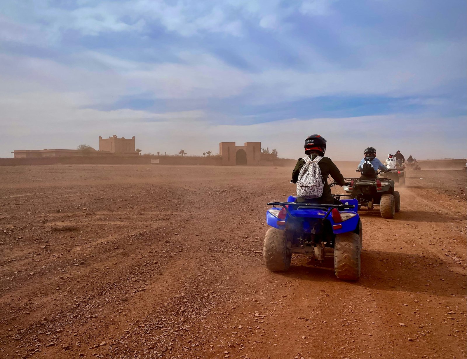 Group of quad bikes (ATVs) parked in the Moroccan desert during a guided riding tour